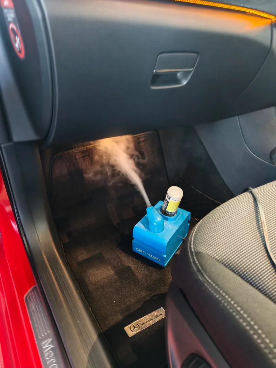Atom nebuliser misting treatment into a vehicle cabin